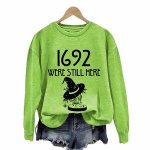 Women’s Were Still Here 1692 Witchy Print Round Neck Sweatshirt Women’s Were Still Here 1692 Witchy Print Round Neck Sweatshirt